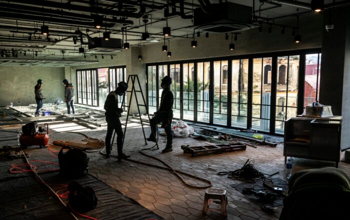 construction industry workers working inside modern building site in ho chi minh city vietnam