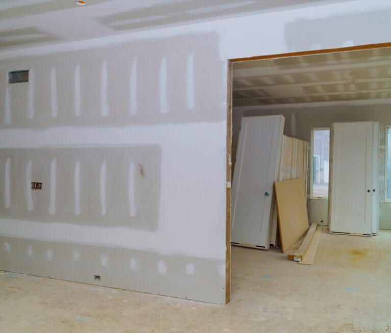 Interior construction of housing with drywall installed door for a new home before installing